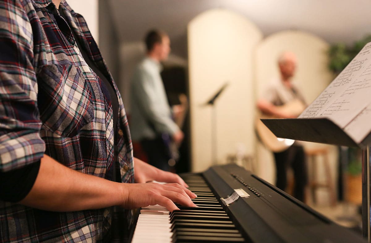Woman playing the keyboard piano